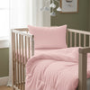 Cot bed with light pink baby cotton duvet cover 100x135 cm