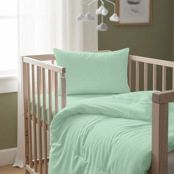 Cot bed with mint green baby cotton duvet cover 100x135 cm