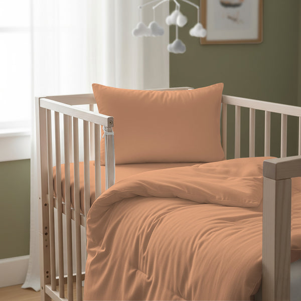 Cot bed with peach baby cotton duvet cover 100x135 cm