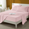 Bed styled in a bedroom with percale cotton Light Pink 4 piece king size sheet set