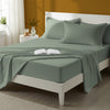 Bed styled in a bedroom with percale cotton Sea Foam 4 piece king size sheet set