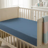 Baby cot setup with 40x90cm Dusty Blue cot fitted sheet moisture wicking and gentle on skin
