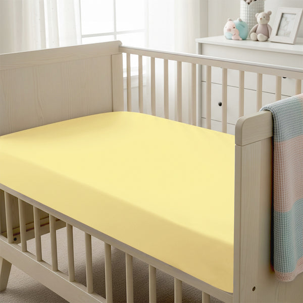 Baby cot setup with 40x90cm Mellow Yellow cot fitted sheet moisture wicking and gentle on skin