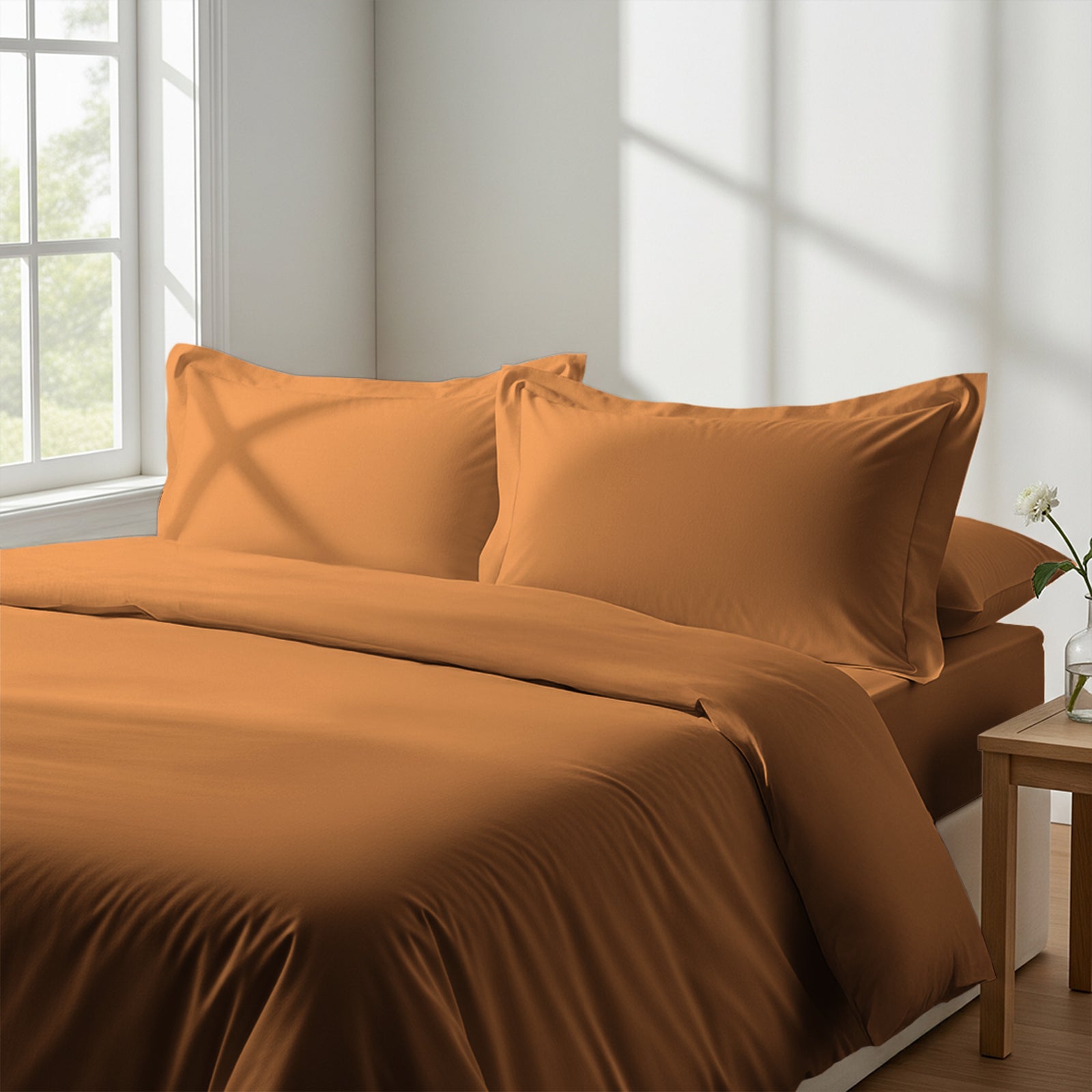 Calm luxurious bedroom bed with Appricot Orange Pizuna Linens cotton duvet cover super king size