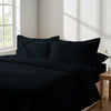 Bedroom with 3 piece 600 thread count black emperor duvet cover and pillowcases on the bed