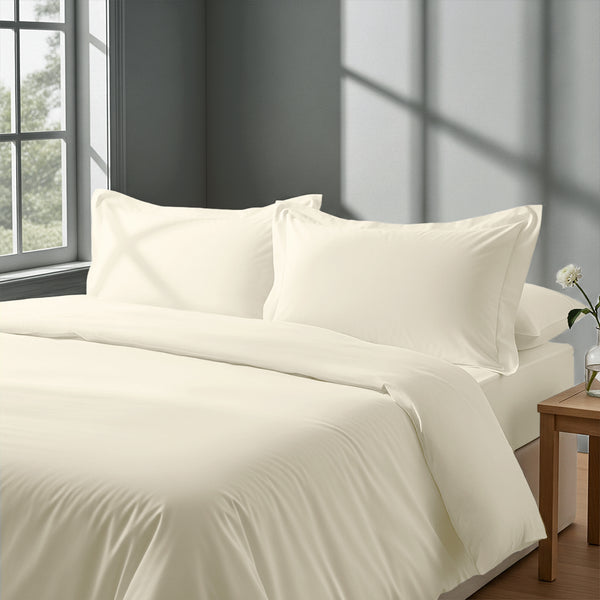 Calm luxurious bedroom bed with Ivory Pizuna Linens cotton duvet cover single size