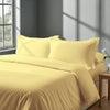 Calm luxurious bedroom bed with Mellow yellow Pizuna Linens cotton duvet cover emperor size