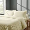 Bed in a bedroom dressed with percale cotton duvet cover Ivory king 3 piece