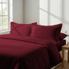 Bedroom with 3 piece 600 thread count rio red double duvet cover and pillowcases on the bed