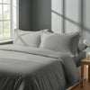 Bed in a bedroom dressed with percale cotton duvet cover silver double 3 piece
