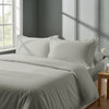 Bed in bedroom dressed with luxurious Silver king 800 thread count duvet cover 3 piece and pillowcases