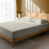 Bedroom bed dressed in Silver super king size 800 thread count luxurious thick fitted sheet