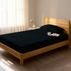 Bedroom with black single size fitted sheet luxurious look
