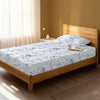 Bed in a bedroom dressed with 400 thread count Carrara Marble Blue EU Single cotton fitted sheet