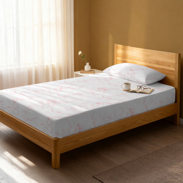 Bed in a bedroom dressed with 400 thread count carrara marble pink single cotton fitted sheet