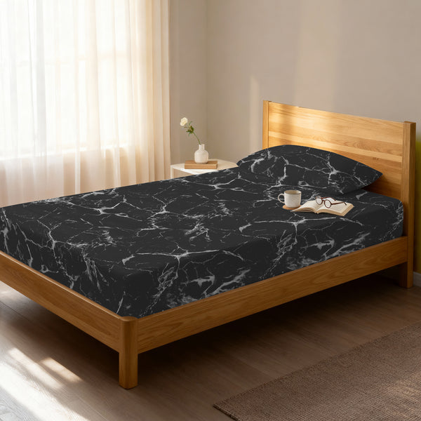 Bed in a bedroom dressed with 400 thread count Marble Black EU Single cotton fitted sheet