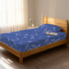 Bed in a bedroom dressed with 400 thread count marble blue small single cotton fitted sheet