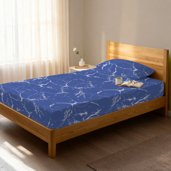 Bed in a bedroom dressed with 400 thread count Marble Blue EU Single cotton fitted sheet