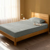 Bed in bedroom dressed with luxurious 1000 thread count silver Single