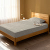 Bed in a bedroom dressed with 400 thread count simply taupe single cotton fitted sheet
