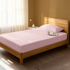 Bedroom with light pink single percale cotton fitted sheet lightweight and cool