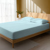 Bed in bedroom dressed with luxurious 1000 thread count baby blue Emperor