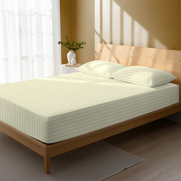 Bed styled with cream striped fitted sheet king size 300 thread count