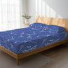 Bed in a bedroom dressed with 400 thread count Marble Blue small double cotton fitted sheet