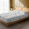 Bed in a bedroom dressed with 400 thread count Marble White Emperor cotton fitted sheet