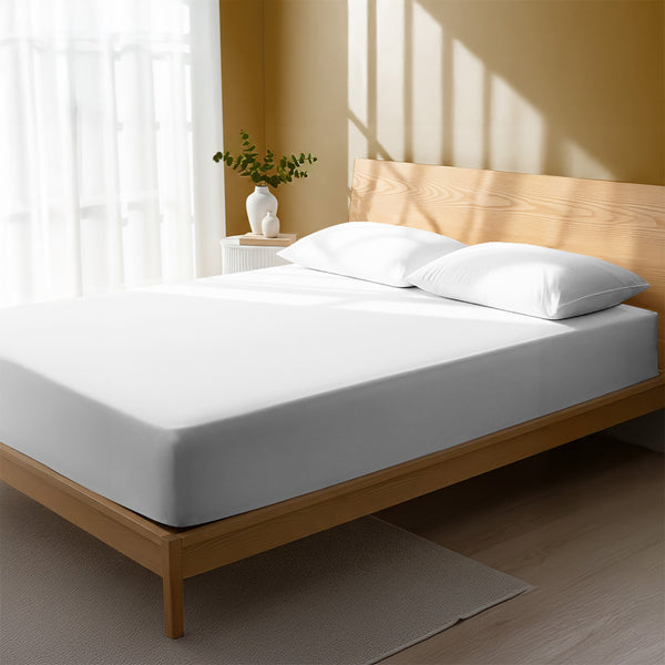 Bed in bedroom dressed with luxurious 1000 thread count white Double