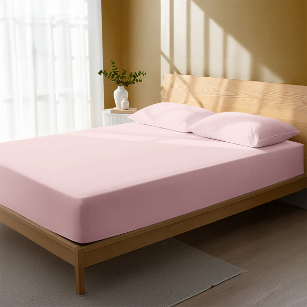 Bedroom with light pink double percale cotton fitted sheet lightweight and cool