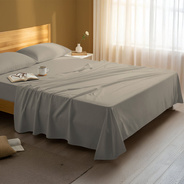 Bedroom bed dressed with premium cotton flat sheet simply taupe double size 600 thread count