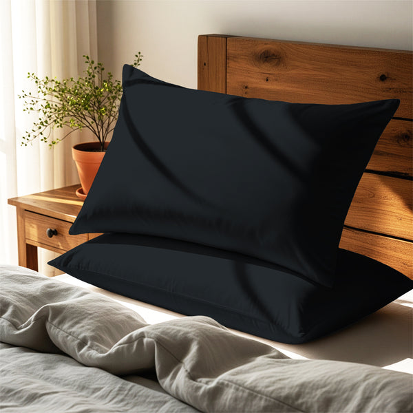 black housewife pillowcases premium 400 thread count on pillows on bed in bedroom