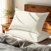 off white housewife pillowcases premium 400 thread count on pillows on bed in bedroom