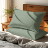 sea foam housewife pillowcases premium 400 thread count on pillows on bed in bedroom