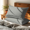Silver housewife pillowcases cotton percale on pillows on bed in bedroom