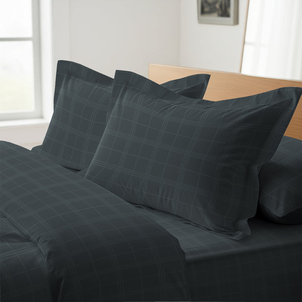 Anthracite checks oxford king pillowcases deluxe 600 thread count on pillows on bed in bedroom
