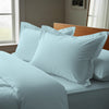 Baby blue oxford standard pillowcases luxurious 800 thread count on pillows on bed in bedroom