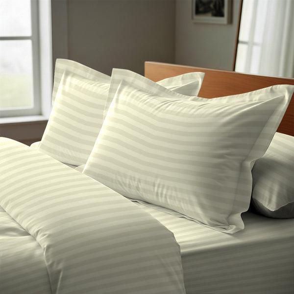 Cream stripe oxford king pillowcases deluxe 600 thread count on pillows on bed in bedroom