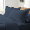 Dark blue oxford king pillowcases luxurious 800 thread count on pillows on bed in bedroom