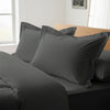 dark grey oxford king pillowcases premium 400 thread count on pillows on bed in bedroom