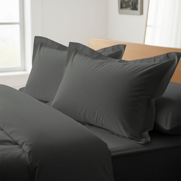 dark grey oxford king pillowcases premium 400 thread count on pillows on bed in bedroom