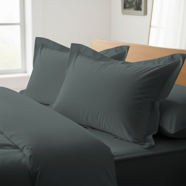 Dark grey oxford king pillowcases royal 1000 thread count on pillows on bed in bedroom