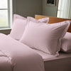 Light pink oxford king pillowcases luxurious 800 thread count on pillows on bed in bedroom