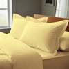 mellow yellow oxford standard pillowcases premium 400 thread count on pillows on bed in bedroom
