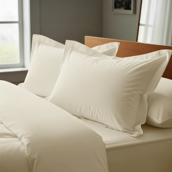 Ivory oxford king pillowcases royal 1000 thread count on pillows on bed in bedroom