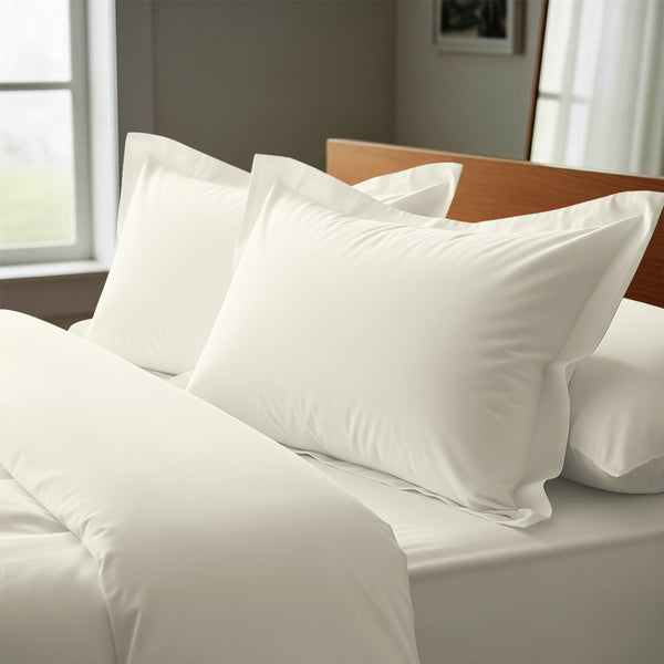 off white oxford king pillowcases premium 400 thread count on pillows on bed in bedroom