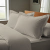 simply taupe oxford standard pillowcases premium 400 thread count on pillows on bed in bedroom