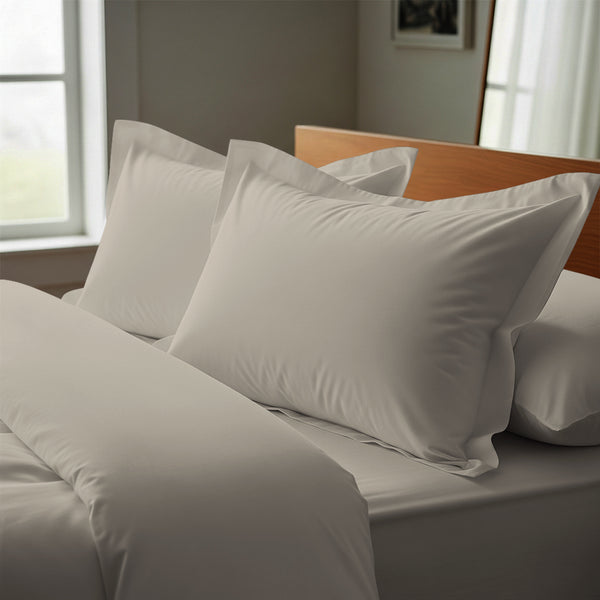 simply taupe oxford standard pillowcases premium 400 thread count on pillows on bed in bedroom