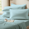 Baby blue oxford standard pillowcases premium 400 thread count on pillows on bed in bedroom